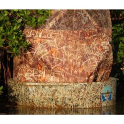 The woodsman hunting boat and ameristep round boat blind sitting deep in the mangroves, closer crop